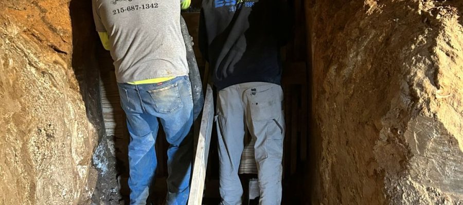 Foundation underpinning excavation beneath existing West Chester home