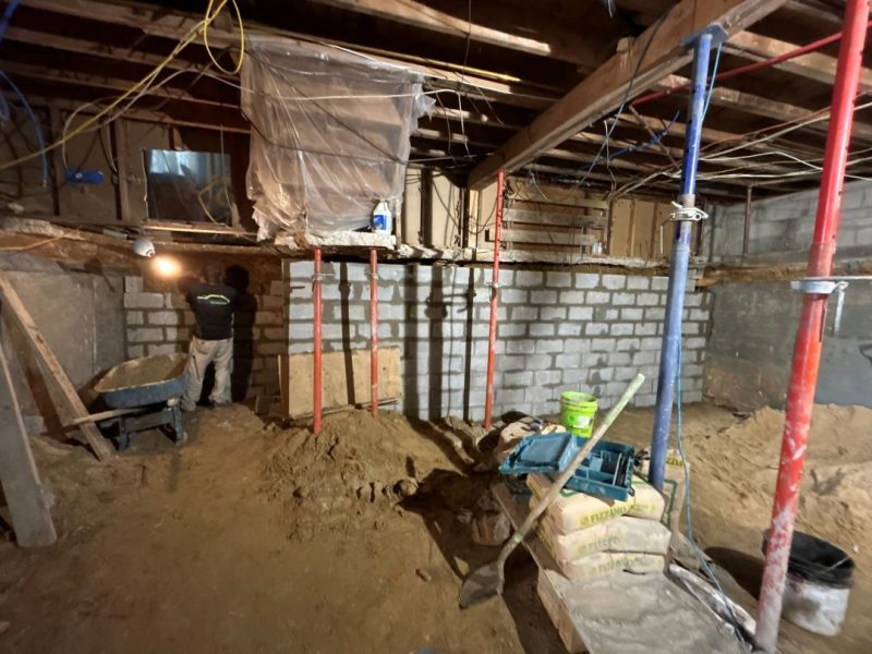 New masonry foundation wall construction during basement conversion